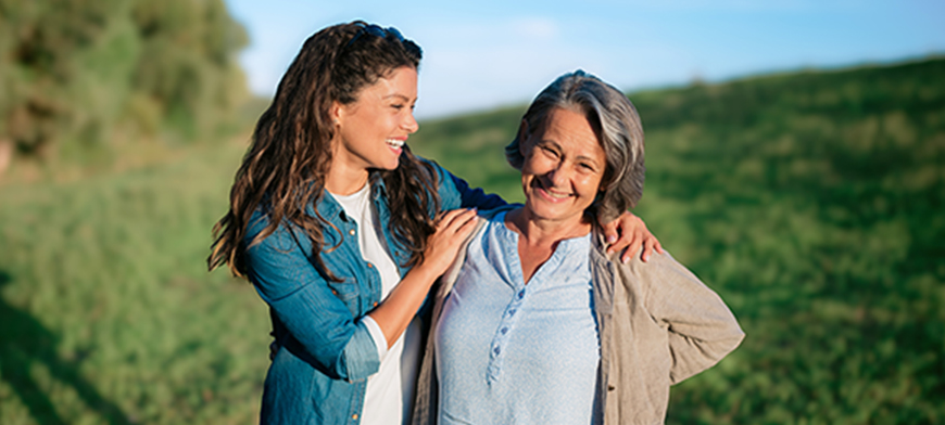 two people smiling together